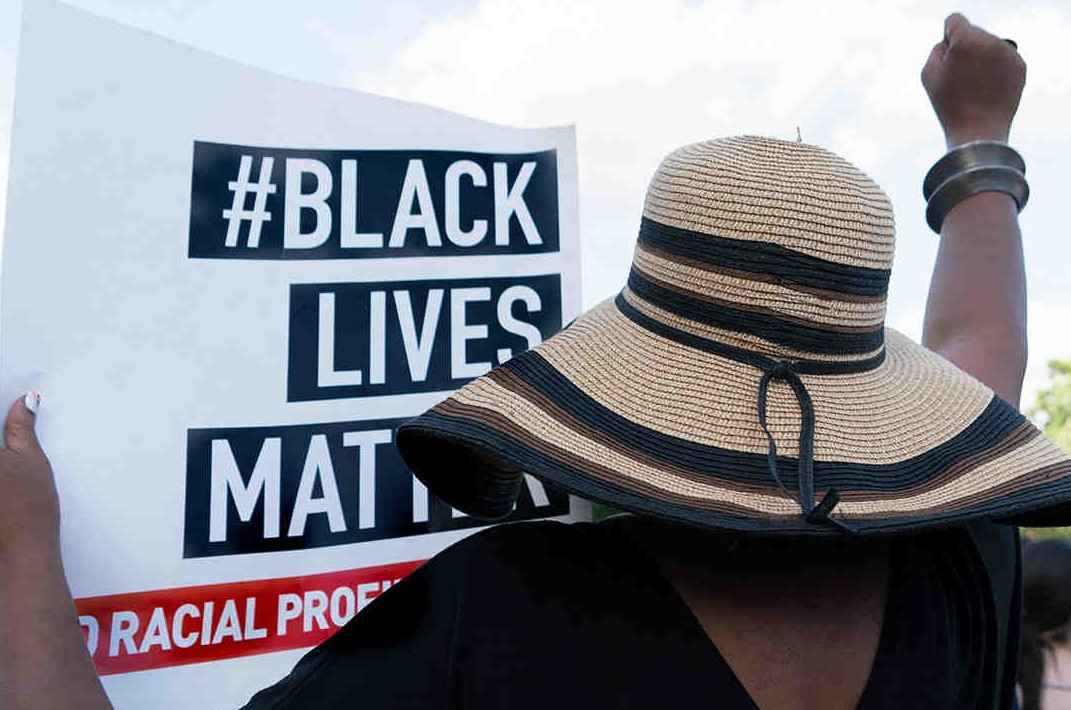 web19-protester-with-black-lives-matter-sign-1160x768.jpg
